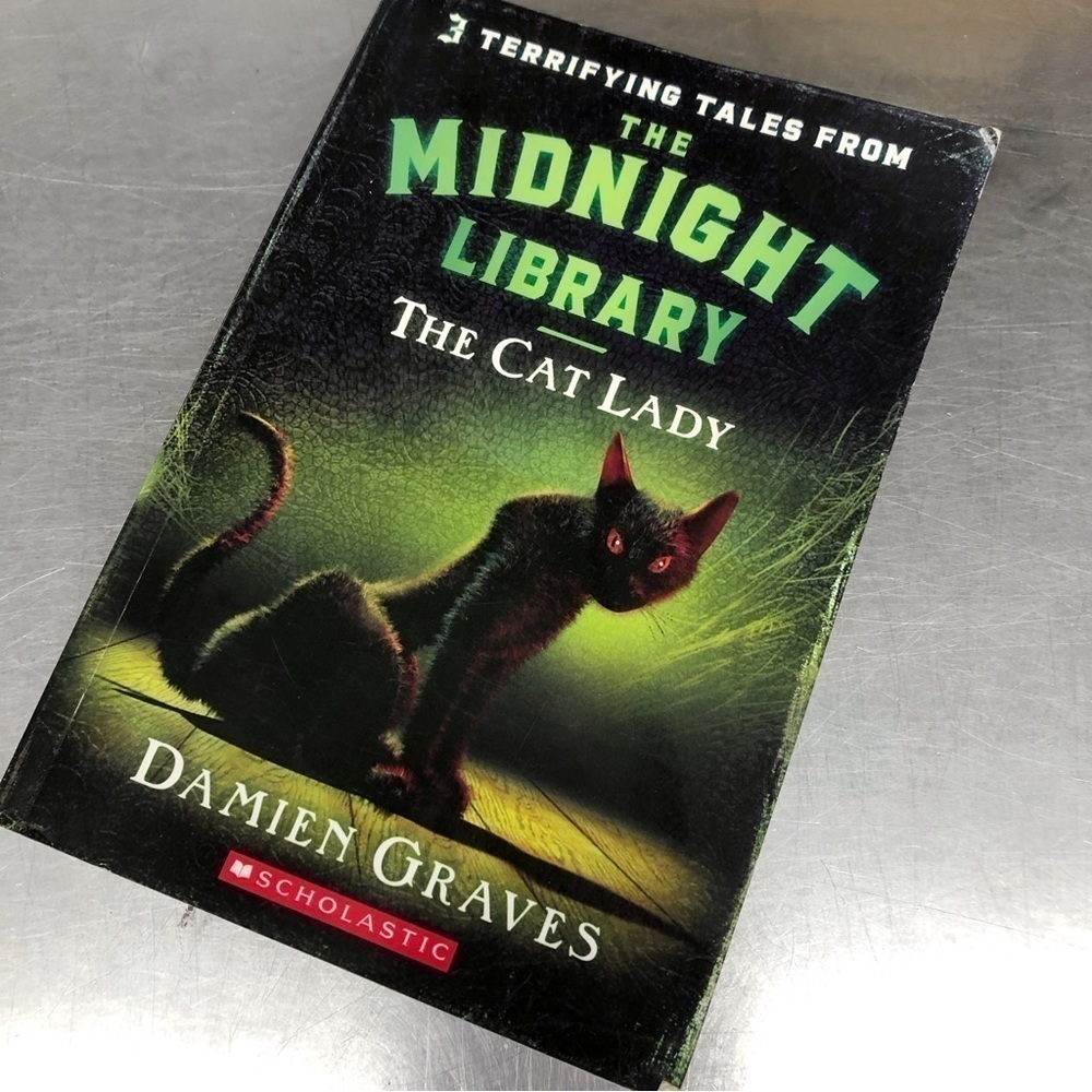 The Midnight Library: Cat Lady by: Damian Graves, paperback book